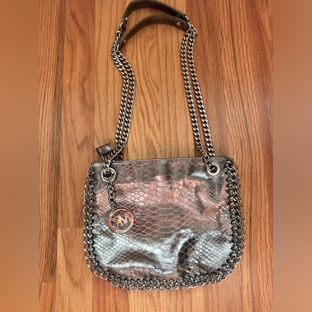 Michael Kors silver metallic purse/handbag. Silver chain. Adjustable.